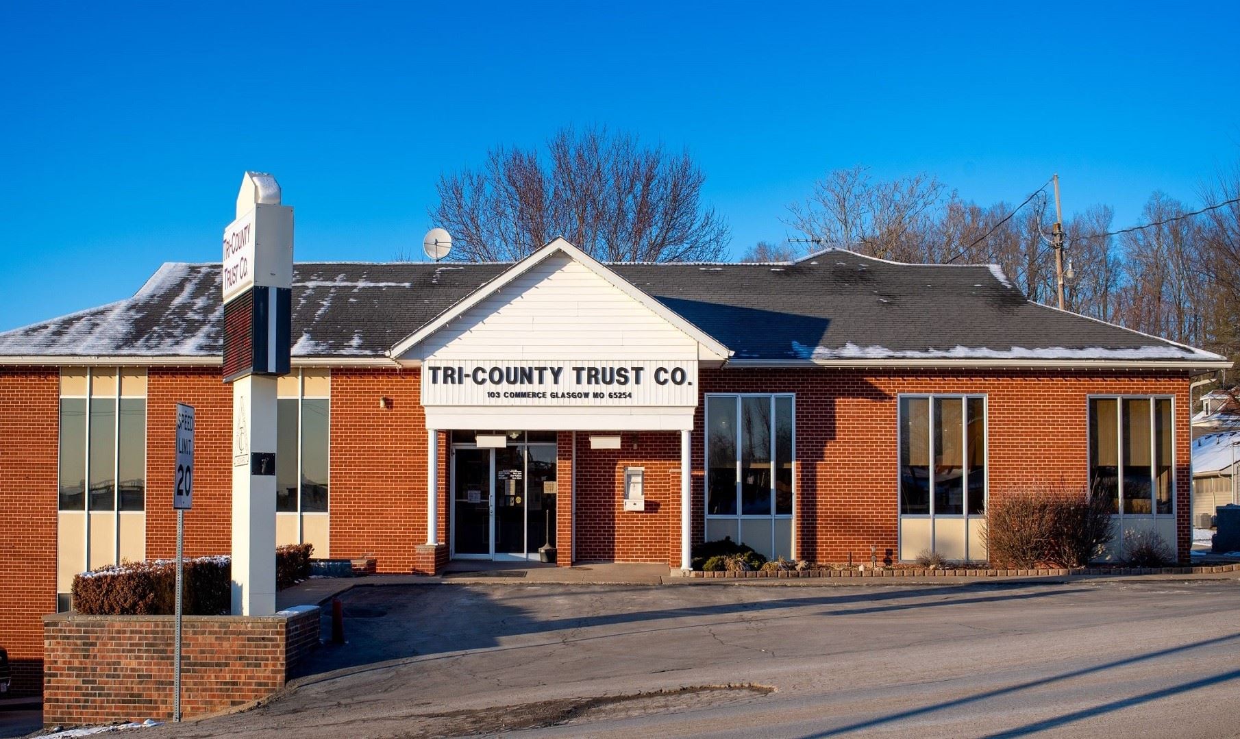 Tri-County Trust Co building with a blue sky in the back ground